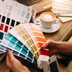 A person selecting a paint color for their project