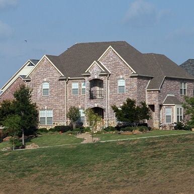 Exterior of brick home in Argyle by Platinum Painting