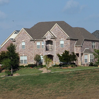 Exterior of brick home in Coppell by Platinum Painting