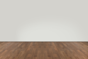 a room with wood floors and white walls 