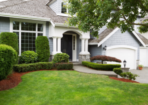 the front exterior of a white and gray house